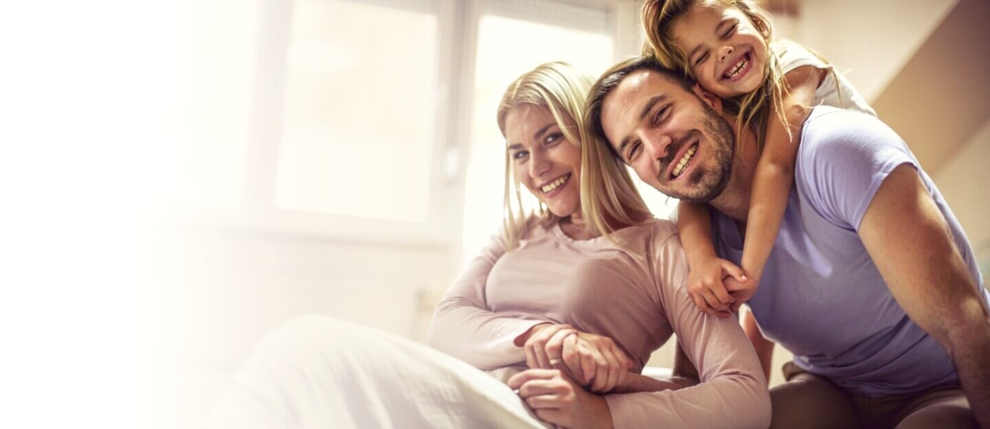 family of three smiling