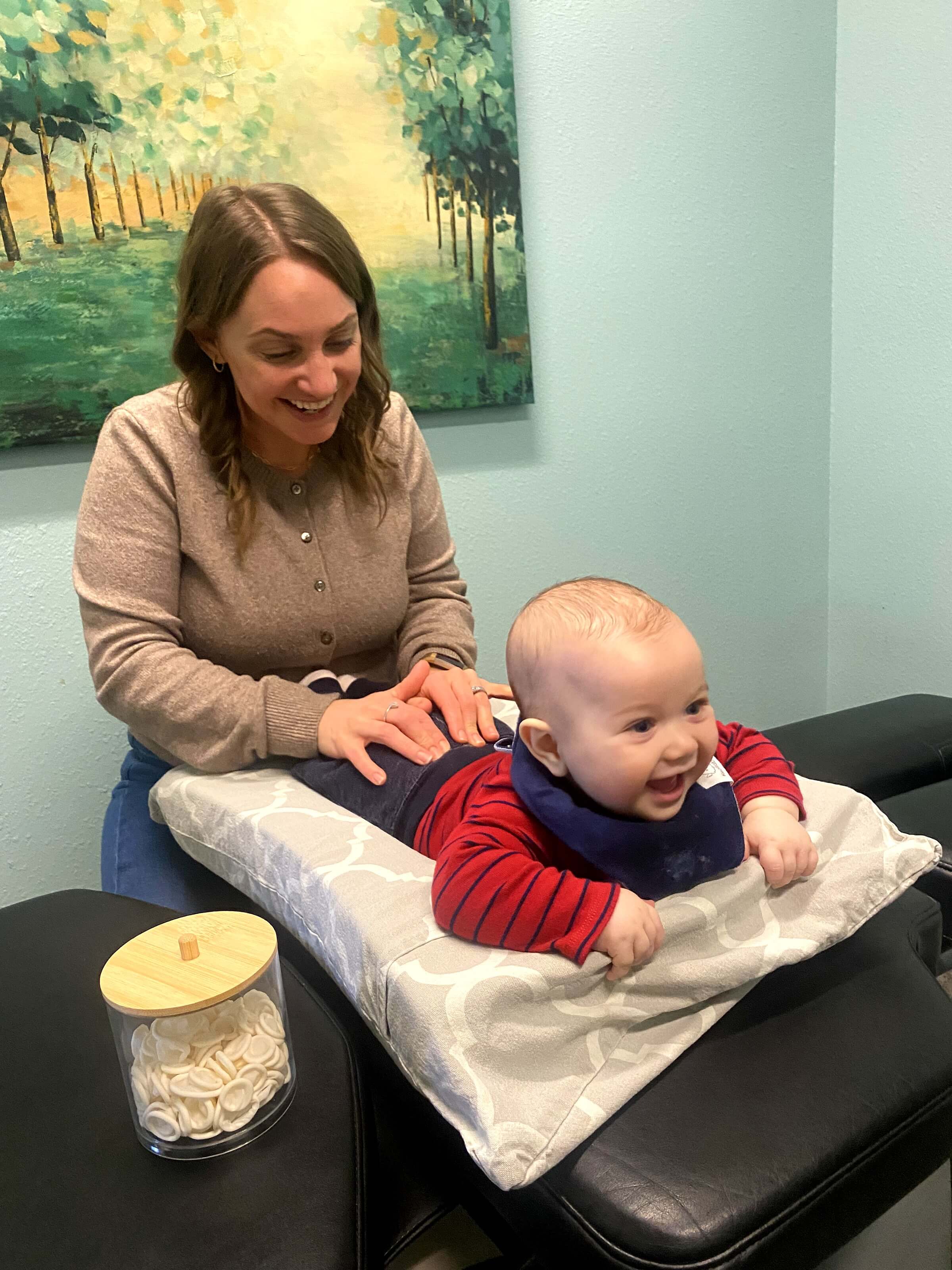 Gentle infant chiropractic adjustment for colic and sleep issues at Absolute Chiropractic + Wellness in Kenosha WI