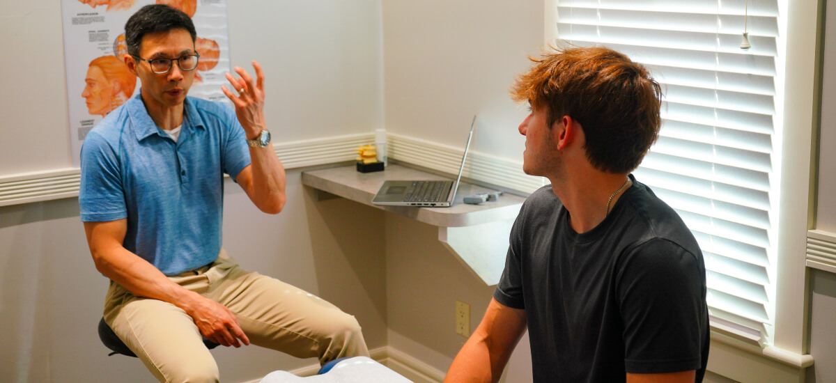 Edmonton chiropractor in a consultation with a patient