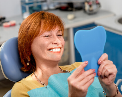 Female patient with new dentures