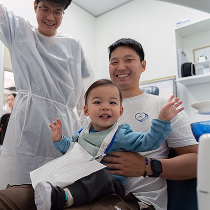 dentist and smiling child patient