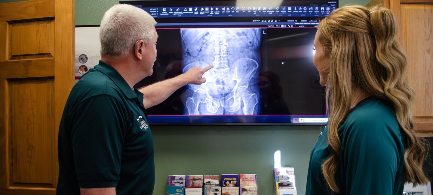 Chiropractor explaining x-ray
