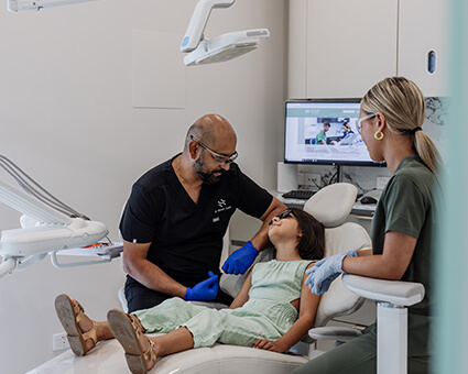 Child looking at dentist