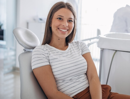 Happy female patient dental visit