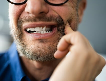 Man with extreme dental pain