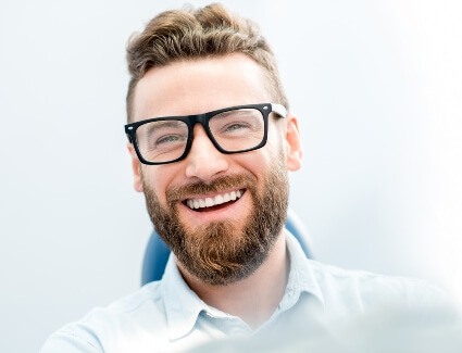 Smiling man with glasses