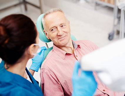 man sitting in a dental chair