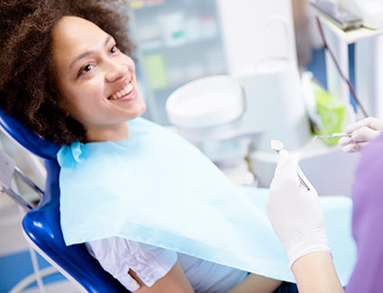 person smiling during a dental visit