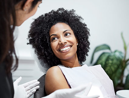 patient smiling in dental chair