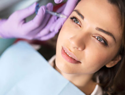 Woman receiving facial injection