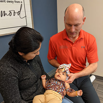 Dr Randy and baby with mom