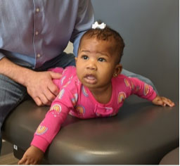 Baby on adjusting table