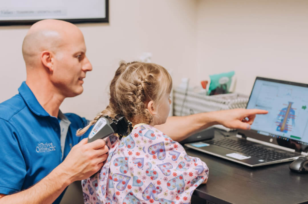 Dr Brandy explaining results to little girl