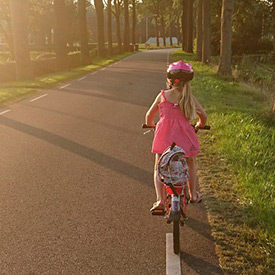 young girl riding a bike