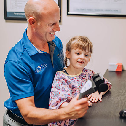 Dr randy talking with child patient