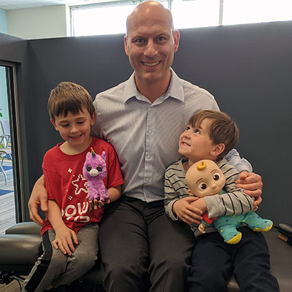 Dr Randy smiling with kids