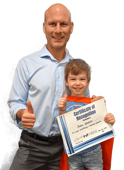 Dr. Randy and child holding certificate