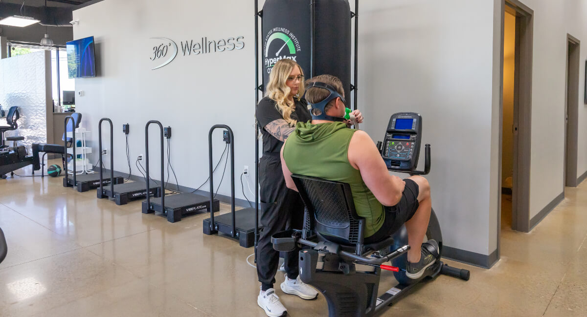 360 Chiropractic & Wellness staff assisting patient with oxygen mask