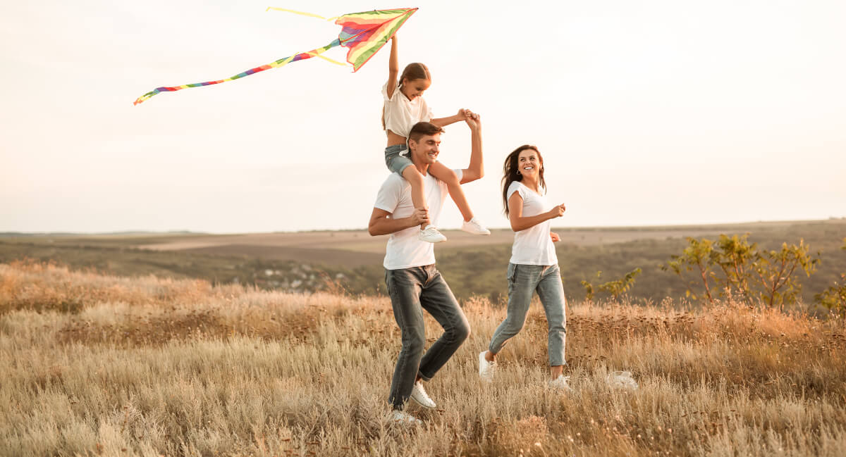 Smiling family of three