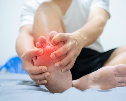 Man with neuropathy related foot pain