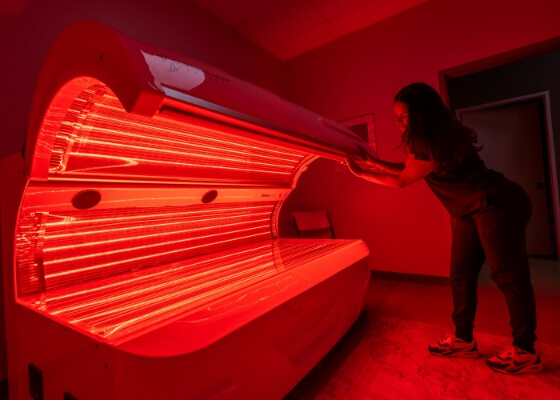 360 Chiropractic & Wellness staff preparing red light therapy equipment