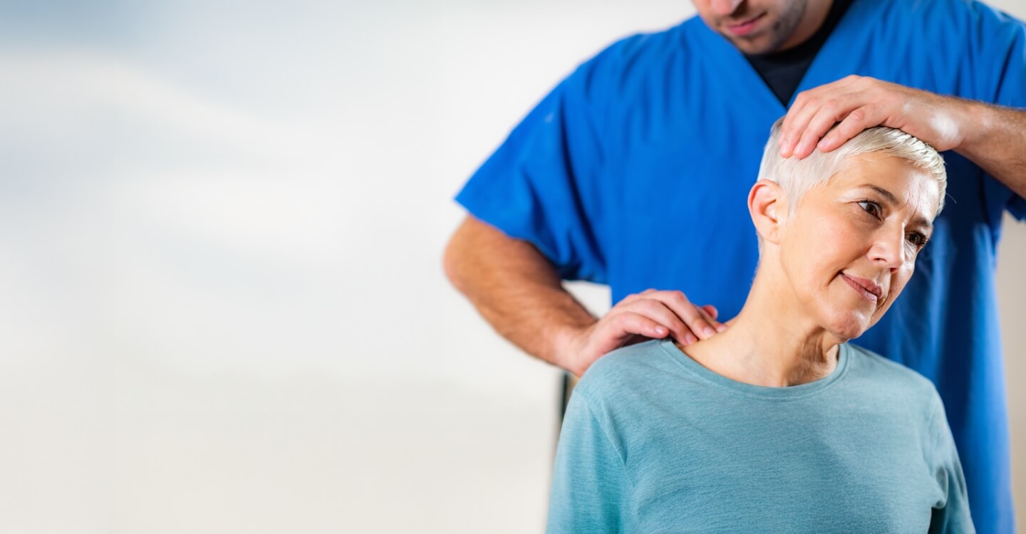 woman having neck adjusted