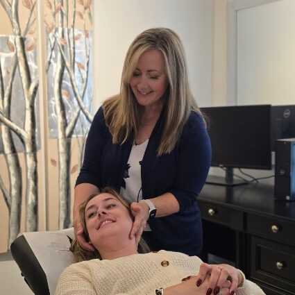 Dr Trina adjusting patients neck