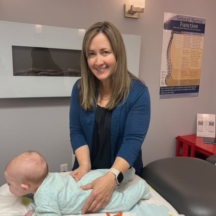 Dr Trina adjusting baby