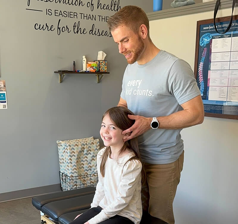 Dr Andrew Adjusting Little Girl