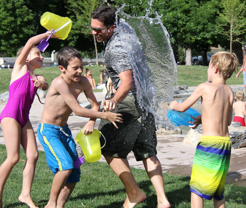 Kids-playing-with-water-outdoors