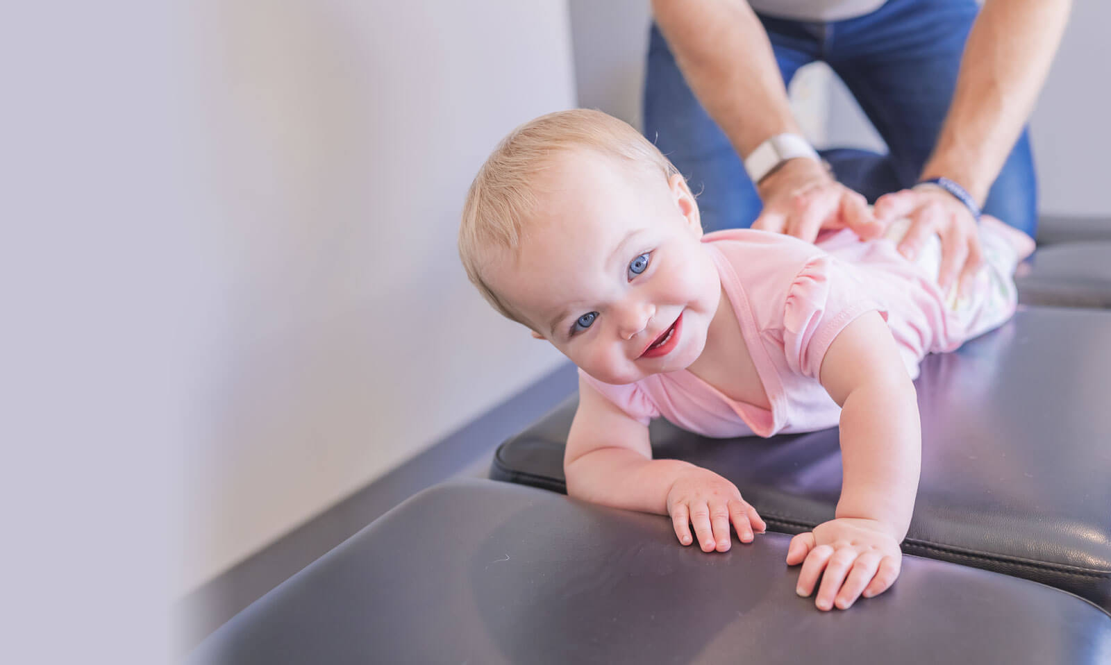 Toddler having back adjusted