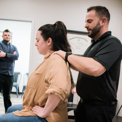 Dr. Dinkel adjusting patient