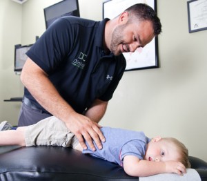 Dr. Dinkel adjusting a child.