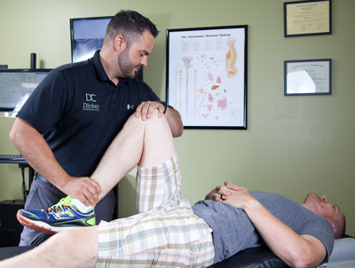 Dr. Dinkel giving chiropractic adjustment.