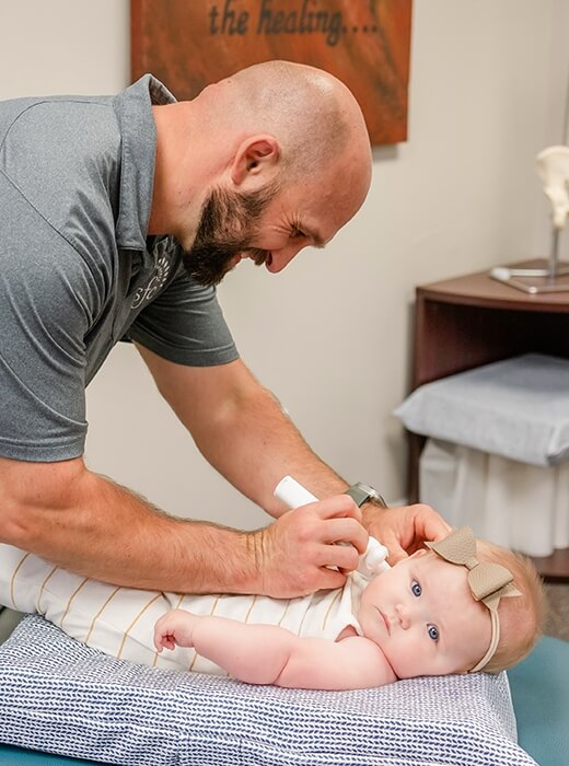 Dr Josh treating a pediatric patient