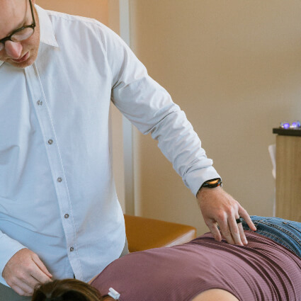 Doctor pressing on back