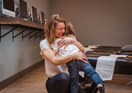 Dr. Lisa hugging little girl