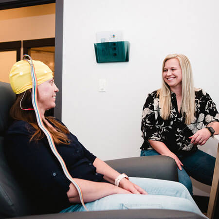 woman receiving neurofeedback therapy