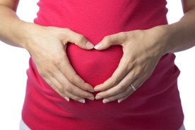 Pregnant Woman With Hands in Shape of Heart