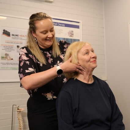 Essendon chiropractor adjusting patient's neck