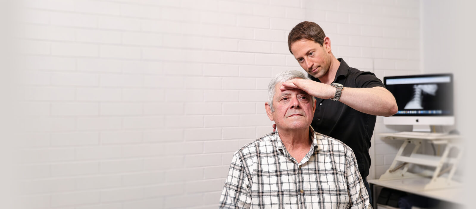 Doctor adjusting patient neck