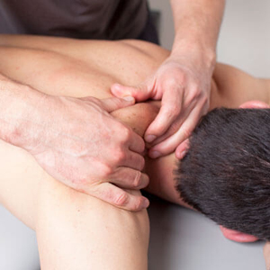 Man receiving sports massage therapy