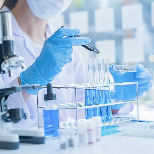 Female scientist performing medical tests