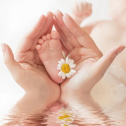 Mom holding baby's foot