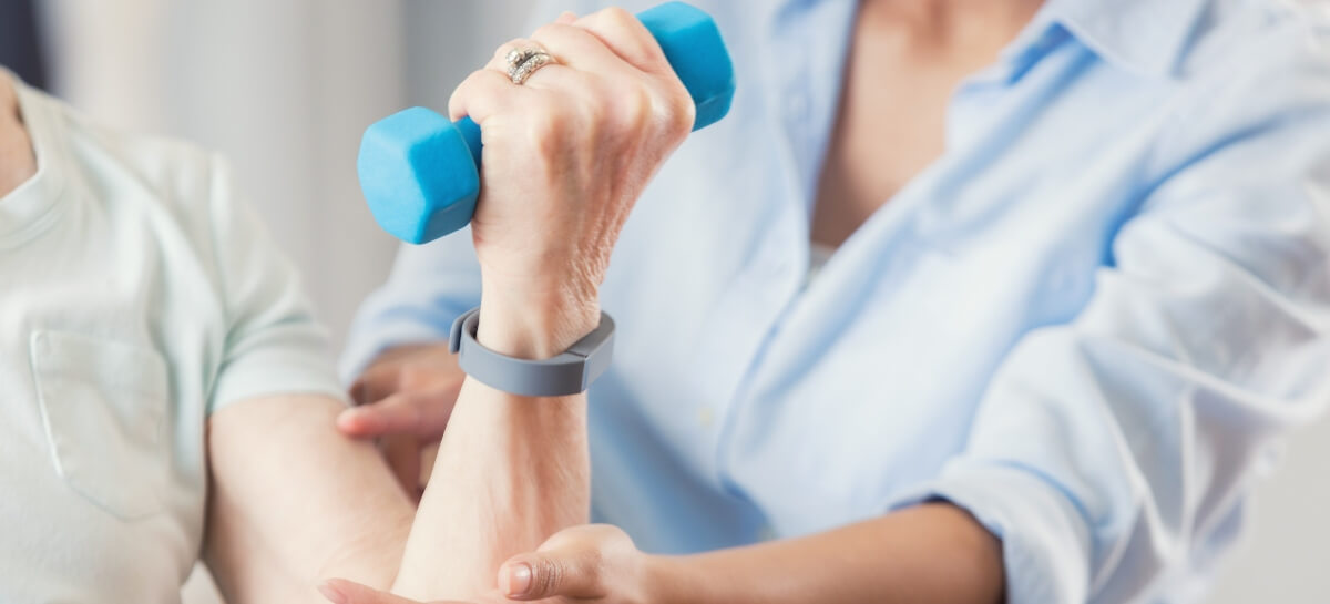 Physiologist assisting patient