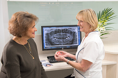 Dr Gillian consulting with patient