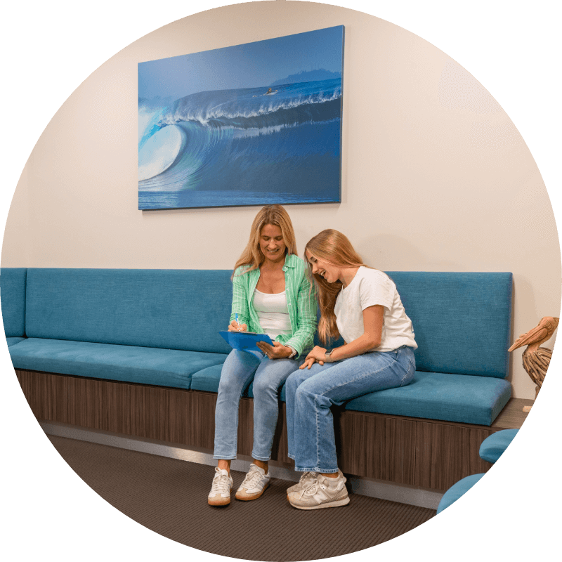 Dee Why patients completing paperwork at Wavescape Orthodontics