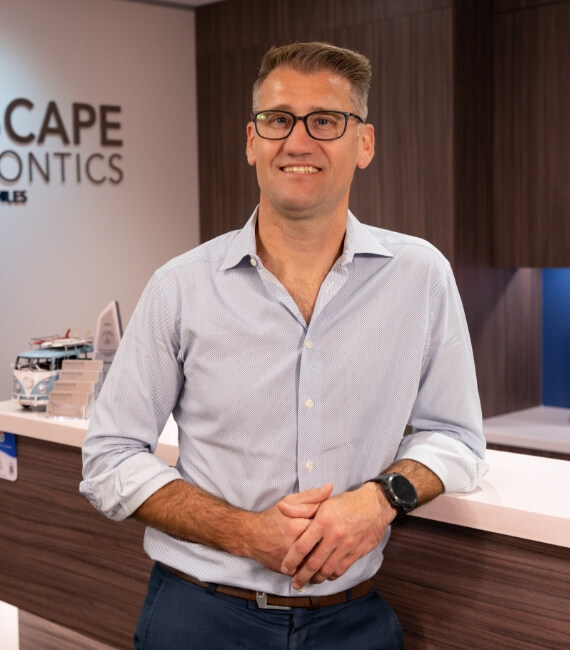 Dee Why orthodontist Dr Riaan Foot standing at reception