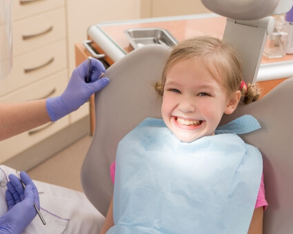 Young child sitting on a dental chair