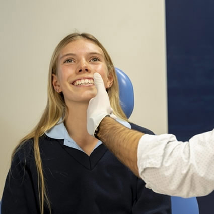 Young girl patient smiling during dental consult